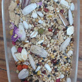 دان مخلوط عروس هلندی و طوطی (بسته 250 گرمی)